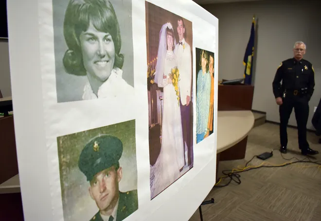 Montana couple photo board with law enforcement in background